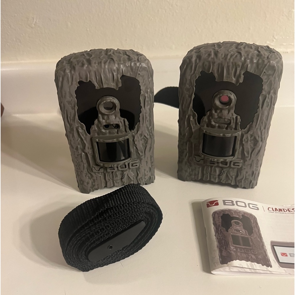 A pair of Bog Clandestine trail, or game cameras. Slightly used.